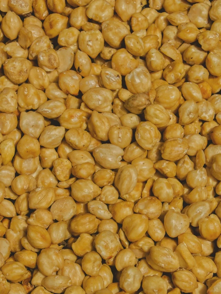 Chickpeas close-up, golden roasted chickpeas with a crisp texture filling the frame.