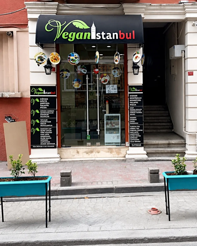 istanbul vegan restaurants guide with the exterior of Vegan Istanbul, a fully vegan restaurant with a visible storefront and menu signs on a quiet city street.