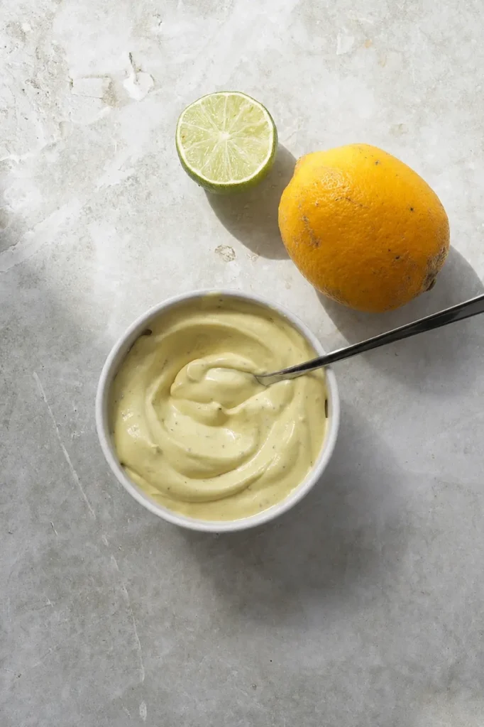 What I eat in a day as a vegan lunch with homemade creamy vegan mayonnaise, lime, and citrus fruit.