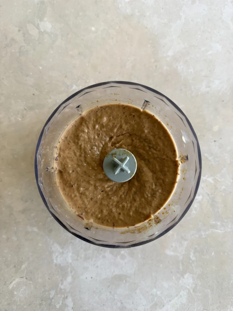 Red kidney bean mixture blended until smooth for high-protein vegan bean brownies.
