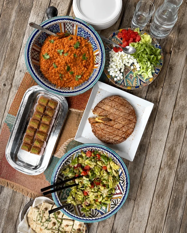 Vegan dishes at Orient Experience II in Venice, Italy, with salads, Middle Eastern-style dips, bread and colourful shared plates.