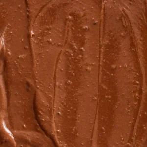 Creamy tofu chocolate pudding with a smooth, glossy texture and visible swirls of dark chocolate.